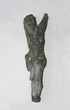 Nukryžiuoto Kristaus skulptūrėlė. Pokario metais stribams šaudant kaip į taikinį nudaužta nuo akmeninio kryžiaus. Lietuva, XX a. 5-6 deš.